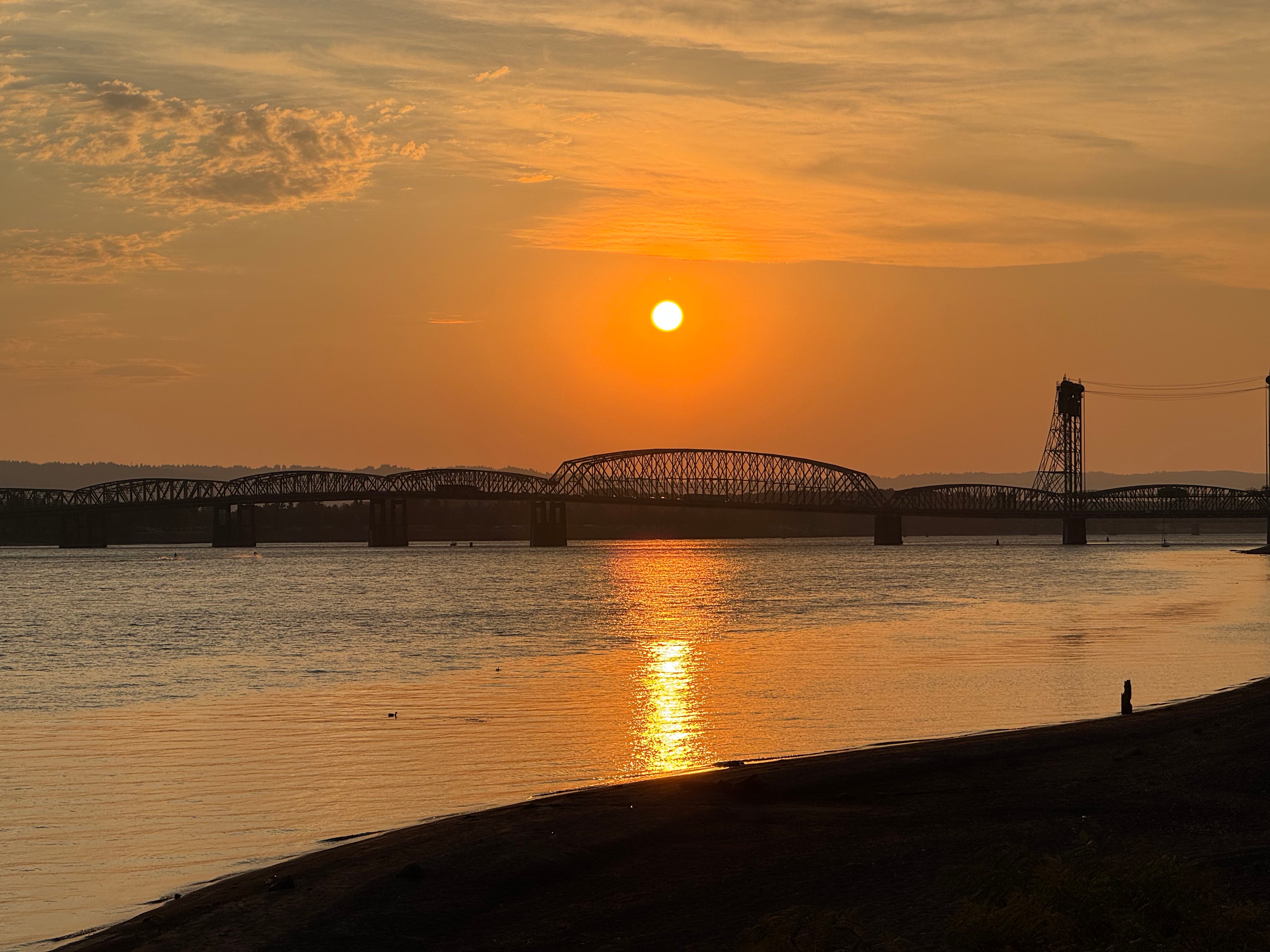 Sunset over bridge in Vancouver Washington where QUIETBAG CLUB is located.